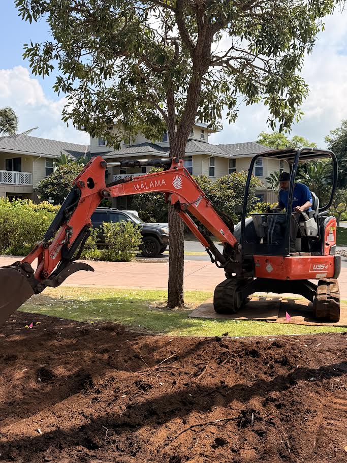 Mālama Landscape construction excavator working on a commercial property on Kauaʻi